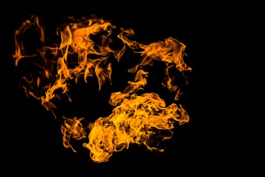 Fire on black background. Fiery patterns. Burning flame. Blazing fire.