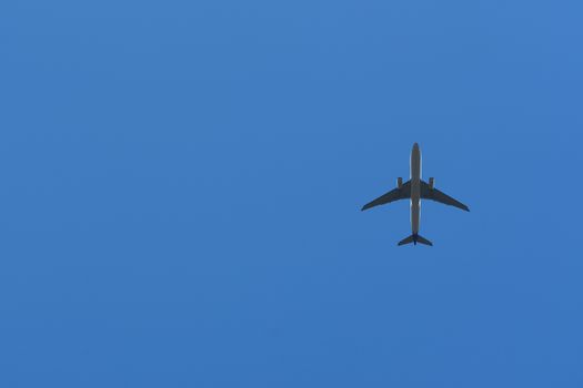 Bottom View of the Airplane in the sky with blank copy space for travel comcept