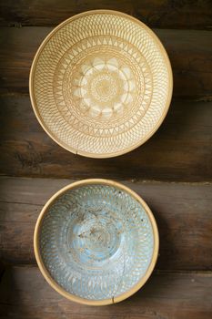 Empty clay bowls on a wooden background. Authentic bowls of Belarus
