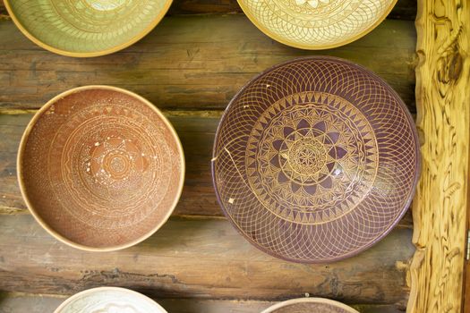 Rustic handmade ceramic and clay bowls and plates decorated by traditional ornament and pattern. Authentic from Belarus
