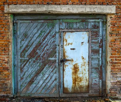 Old garage closed double doors view from outside