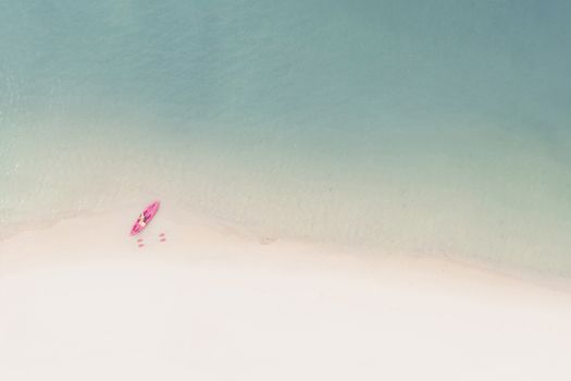 Aerial View of Sandy Beach with kayak boat with Blue Sea