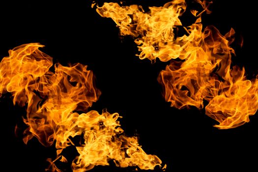 Fire on black background. Fiery patterns. Burning flame. Blazing fire. Flaming patterns and abstract smoke. Concept, idea, project. 