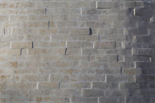 whitewash brick wall horizontal background with side sunlight