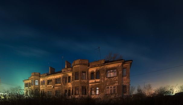 Old double-decker house at night