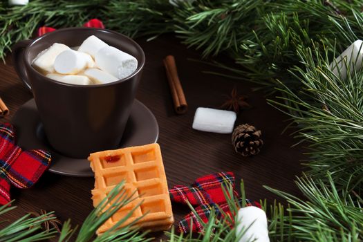 Christmas composition. A Cup of coffee and Vienna waffle, Christmas toys on a wooden background. The decoration of Christmas wreaths. Winter, new year concept. Flat lay, top view. Marshmallow. 2020