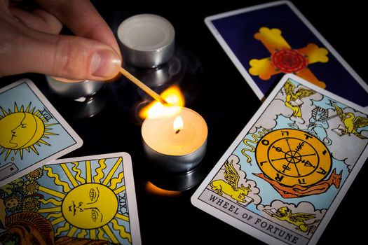 Tarot card reading. Christmas divination, ritual, rite. Magical crystal, candle. Predicting the future. Love spell. Witchcraft, magic.