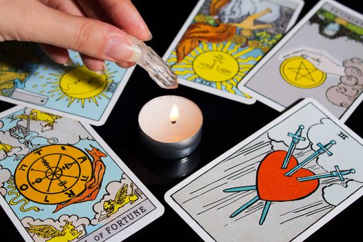 Tarot card reading. Christmas divination, ritual, rite. Magical crystal, candle. Predicting the future. Love spell. Witchcraft, magic.