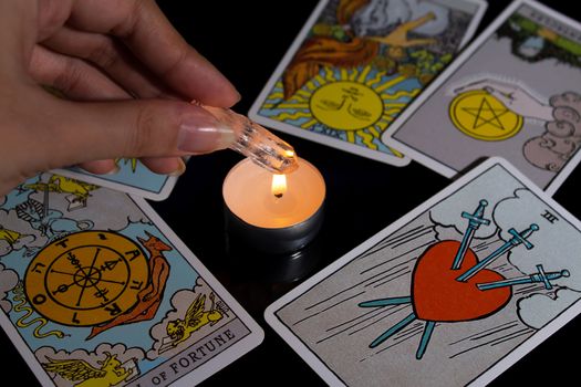 Tarot card reading. Christmas divination, ritual, rite. Magical crystal, candle. Predicting the future. Love spell. Witchcraft, magic.