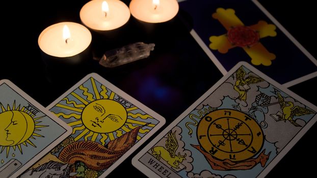Tarot card reading. Christmas divination, ritual, rite. Magical crystal, candle. Predicting the future. Love spell. Witchcraft, magic.