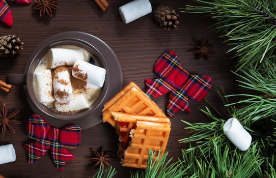 Christmas composition. A Cup of coffee and Vienna waffle, Christmas toys on a wooden background. The decoration of Christmas wreaths. Winter, new year concept. Flat lay, top view. Marshmallow. 2020
