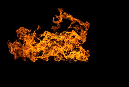 Fire on black background. Fiery patterns. Burning flame. Blazing fire.	