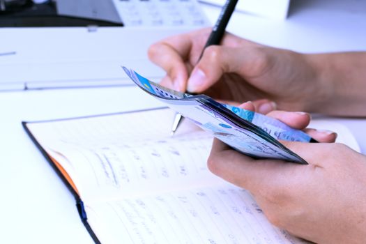 Tenge in the hands of an accountant cashier at a company in Kazakhstan.