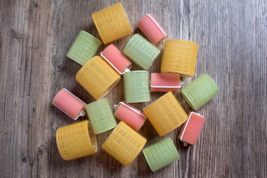 Velcro curlers on a wooden background. Curl, wave, volume, hair. Beauty, fashion. Hairdresser. stylist. Hair rollers. Hair Curlers