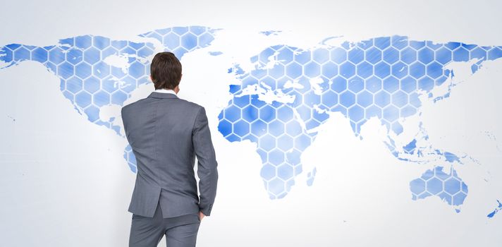 Thinking businessman against background with world map