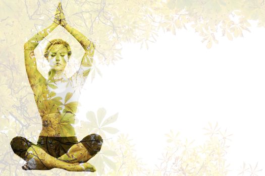 Calm blonde meditating in lotus pose with arms raised against autumnal leaves against the clear sky