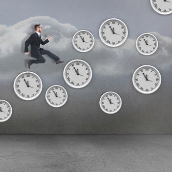 Geeky young businessman running mid air against clouds in a room