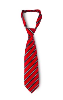 Red men's striped tie taken off for leisure time, isolated on white background. With clipping path.