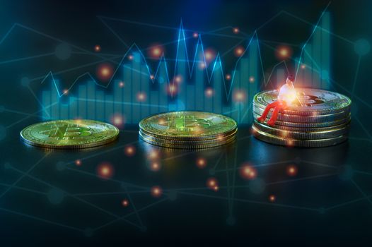 Miniature people, small model human figure sitting on golden Bitcoins with column and line graph on dark background with copyspace for your text. Cryptocurrency or digital money concept.