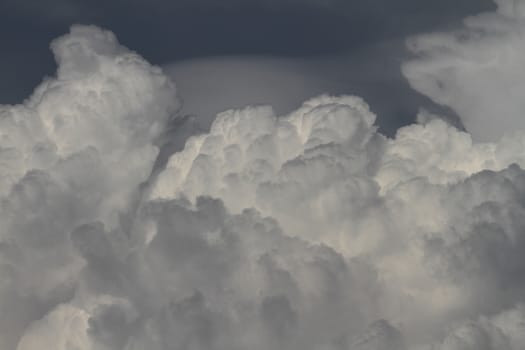 Blue sky background with white fluffy clouds