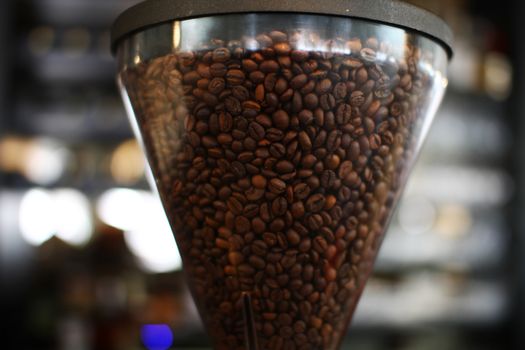 coffee beans in a grinding machine in restaurant