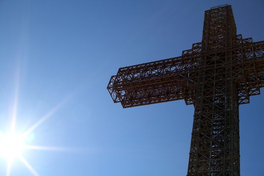 big Orthodox Christian Cross, blue sky sun day