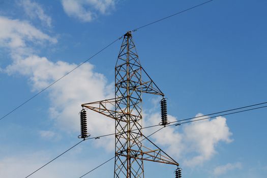 Power lines transmission line blue sky with clouds