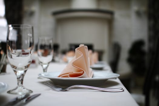 table set in a restaurant, cups and plates