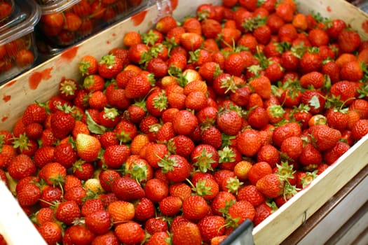 red strawberry in crate, fresh and organic