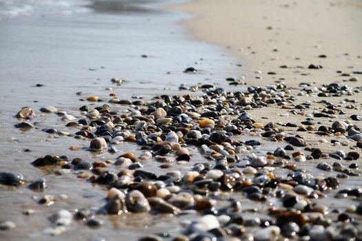 Sea beach with small rocks, close up