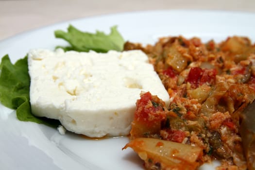 decorated white cheese in a serving plate in restaurant