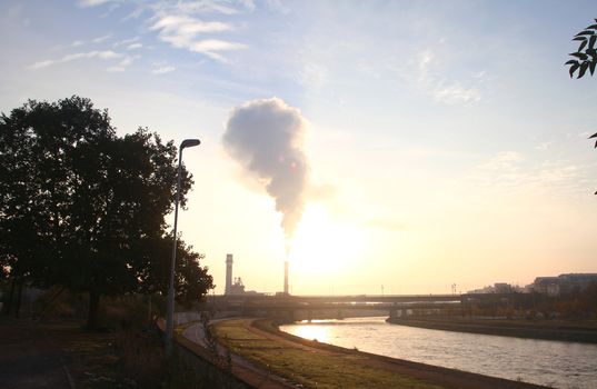 factory chimney smoke toxic on the are at sunrise sunrise