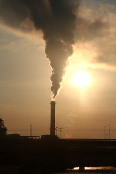 factory chimney smoke toxic on the are at sunrise sunrise