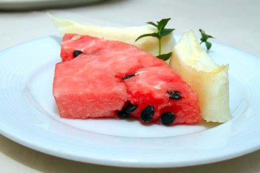 melon and watermelon in serving plate in restaurant