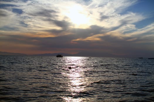 Red purple orange sunset over sea, beautiful cloud space