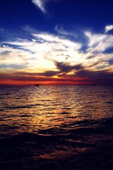 Red purple orange sunset over sea, beautiful cloud space