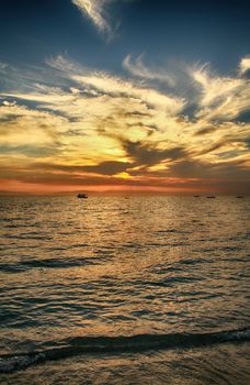 Red purple orange sunset over sea, beautiful cloud space