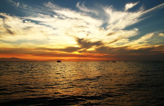 Red purple orange sunset over sea, beautiful cloud space