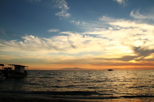 Red purple orange sunset over sea, beautiful cloud space