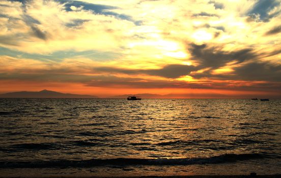 Red purple orange sunset over sea, beautiful cloud space