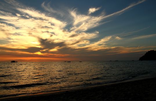 Red purple orange sunset over sea, beautiful cloud space