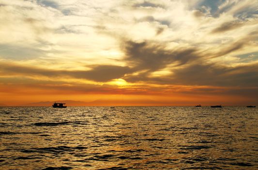 Red purple orange sunset over sea, beautiful cloud space