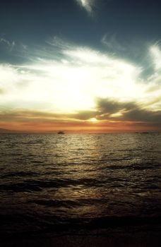 Red purple orange sunset over sea, beautiful cloud space