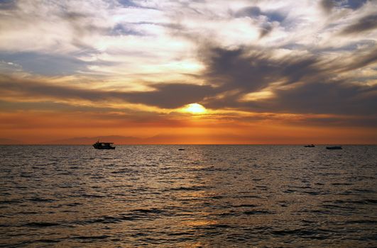 Red purple orange sunset over sea, beautiful cloud space