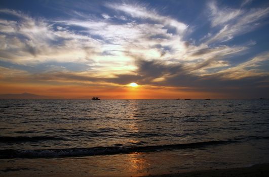 Red purple orange sunset over sea, beautiful cloud space