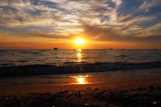 Red purple orange sunset over sea, beautiful cloud space