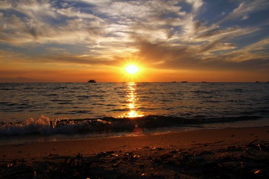 Red purple orange sunset over sea, beautiful cloud space