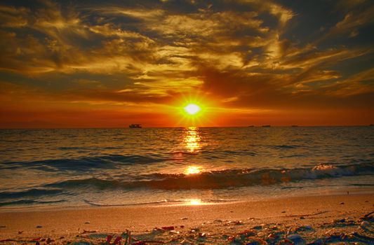 Red purple orange sunset over sea, beautiful cloud space