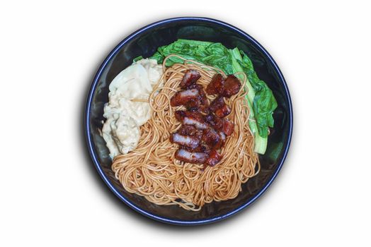 Traditional Chinese wantan mee noodle  served with char siew braised pork and cabbage on dark wooden table