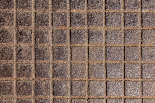 square notches cast iron rusted floor background